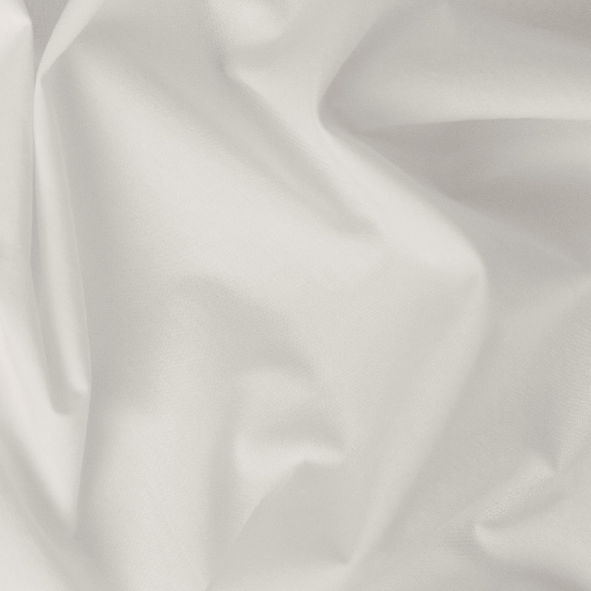 Close-up view of the fabric on the Tuft and Needle Percale Pillowcase Set||color:sand