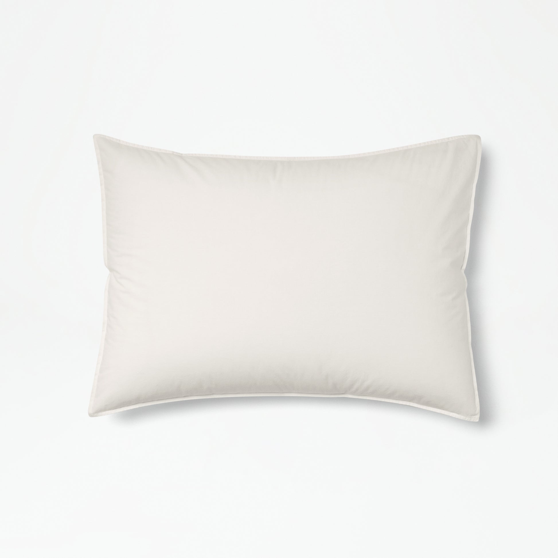 The Tuft and Needle Percale Duvet Cover Set on a mattress in a bedroom||color:sand