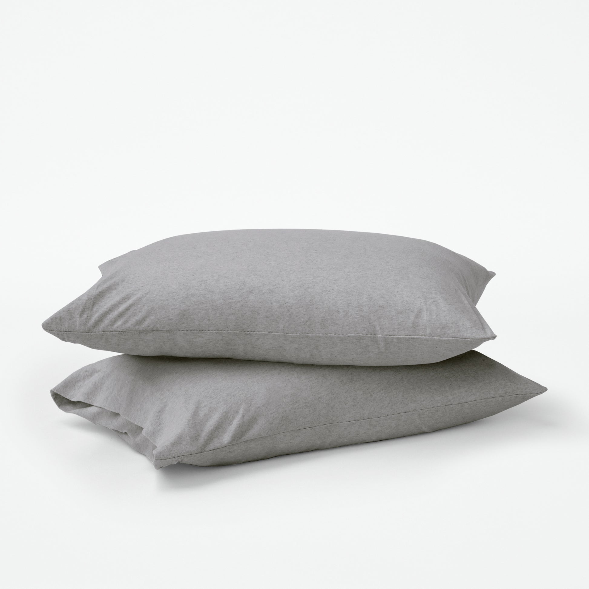 Stacked pillows with grey pillow cases