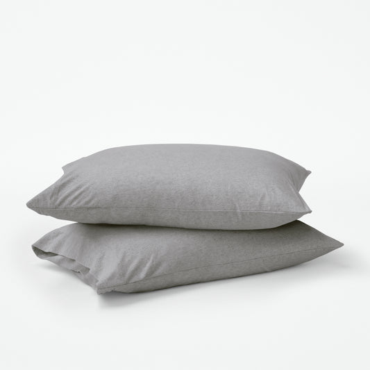Stacked pillows with grey pillow cases