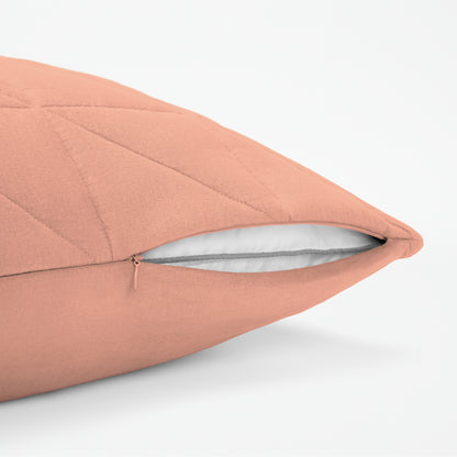 The Tuft and Needle Linen-Cotton Blend Body Pillow Cover, showing a zipper slightly open to the pillow inside || color: Muted Clay
