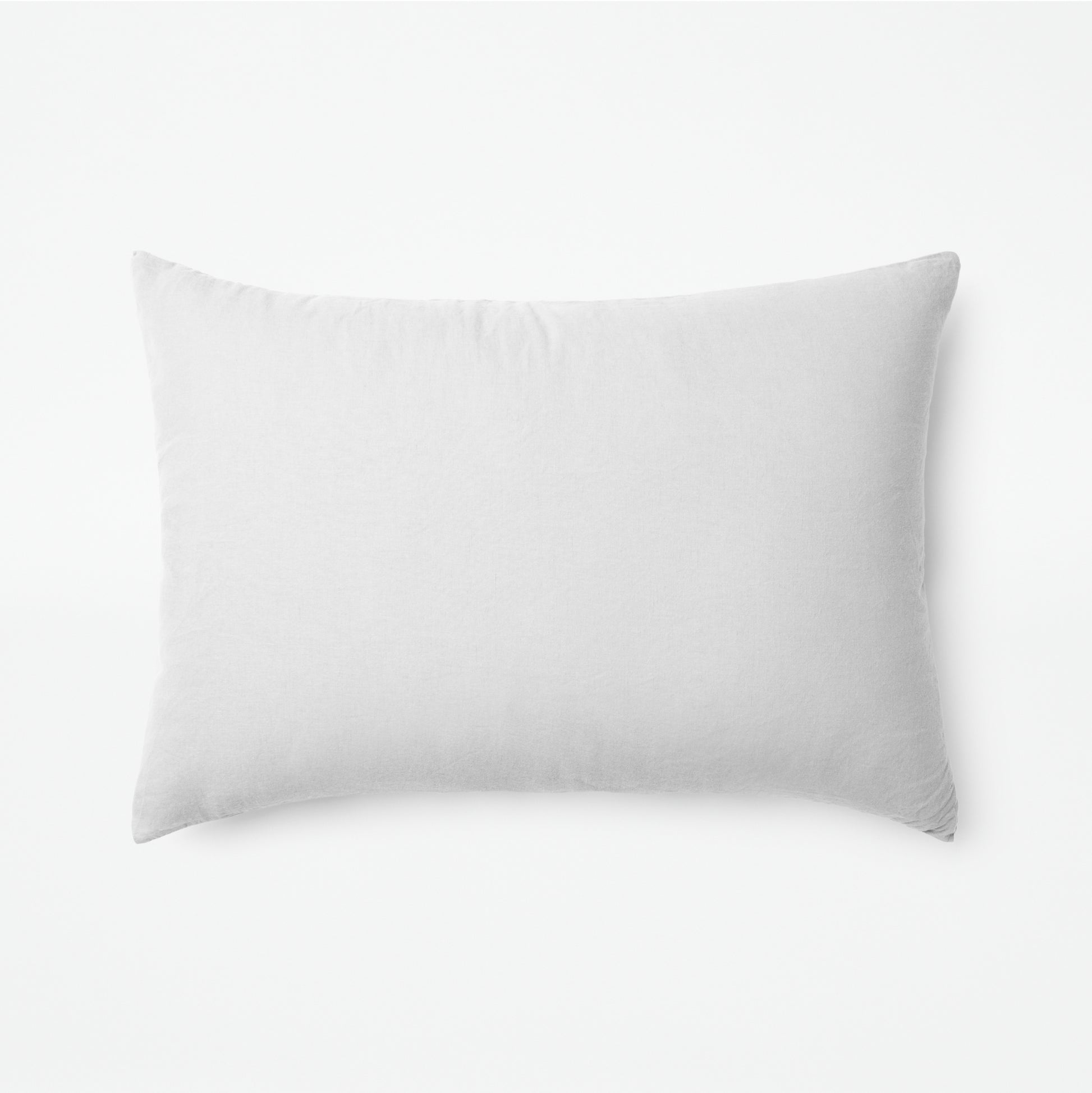The Tuft and Needle Linen-Cotton Blend Duvet Set, one pillow laying horizontally || color: Cloud
