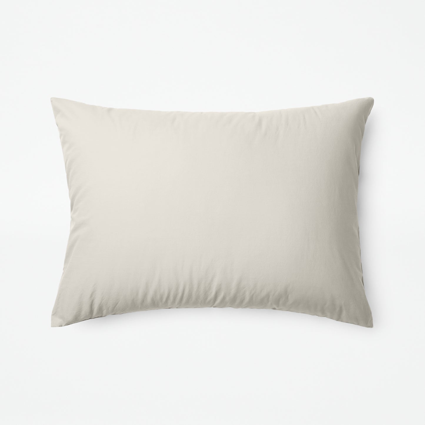 The Tuft and Needle Classic Percale Sheet Set, one pillow laying horizontally || color: Sand

