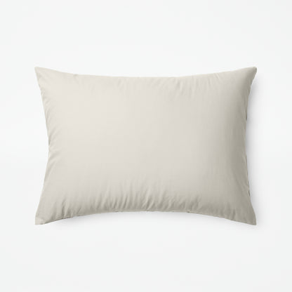 The Tuft and Needle Classic Percale Sheet Set, one pillow laying horizontally || color: Sand
