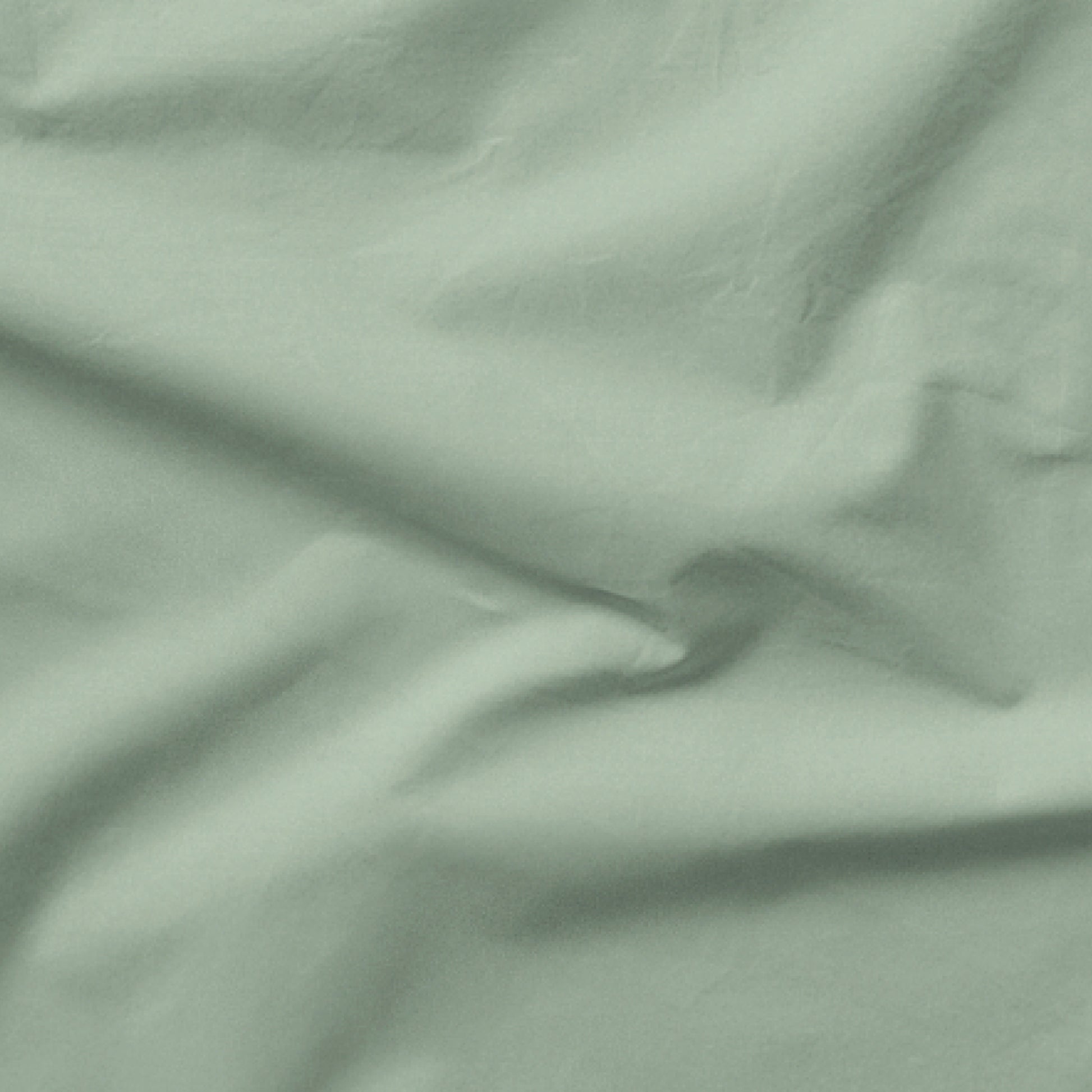 The Tuft and Needle Classic Percale Sheet Set, one sheet spread out || color: Sage