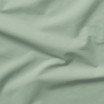 The Tuft and Needle Classic Percale Sheet Set, one sheet spread out || color: Sage