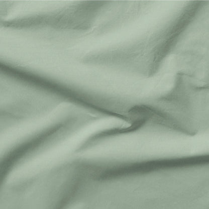 The Tuft and Needle Classic Percale Sheet Set, one sheet spread out || color: Sage
