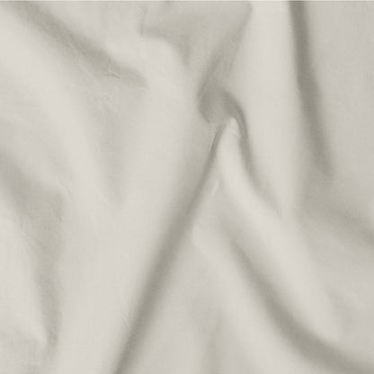 The Tuft and Needle Classic Percale Sheet Set, one sheet spread out || color: Sand
