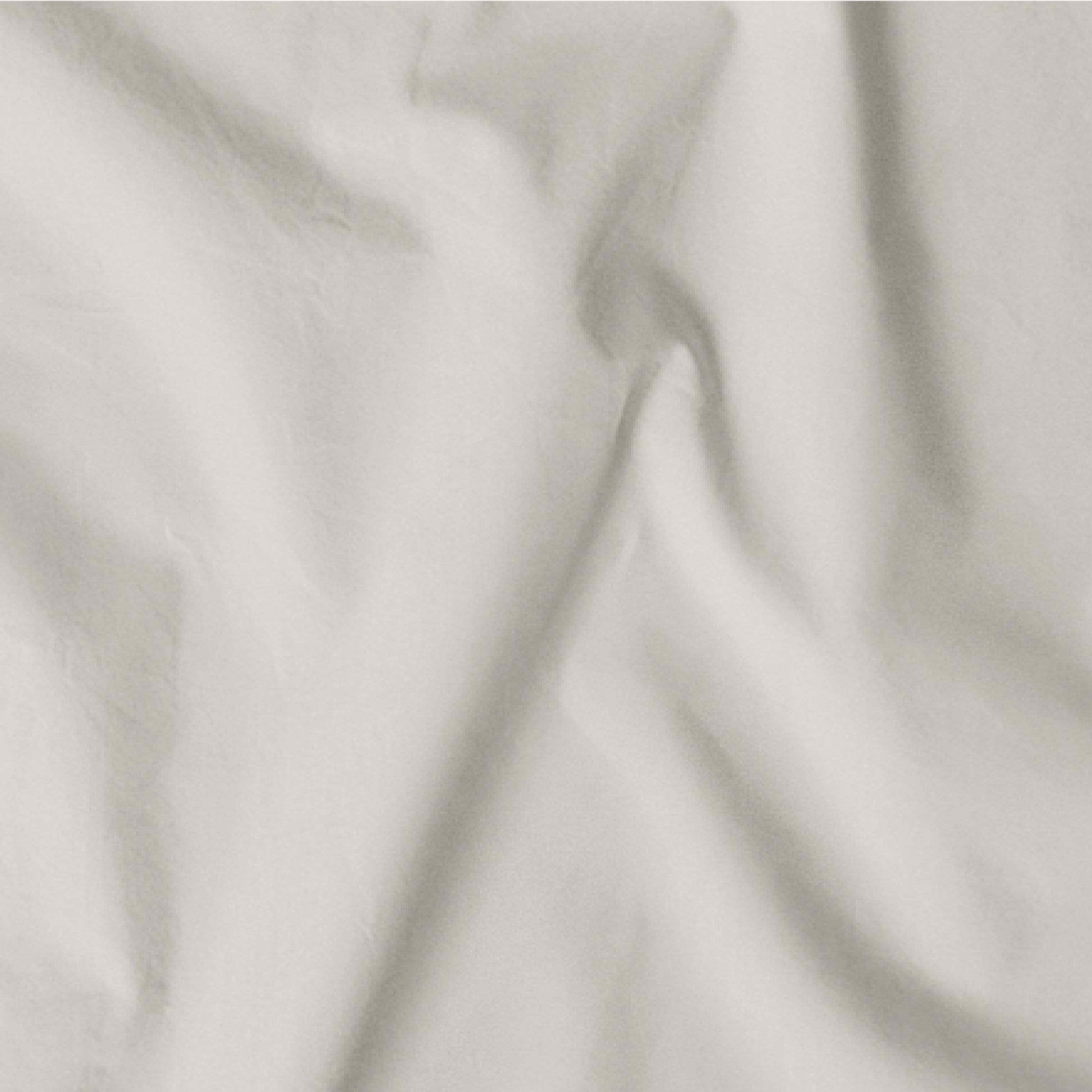 The Tuft and Needle Classic Percale Sheet Set, one sheet spread out || color: Sand
