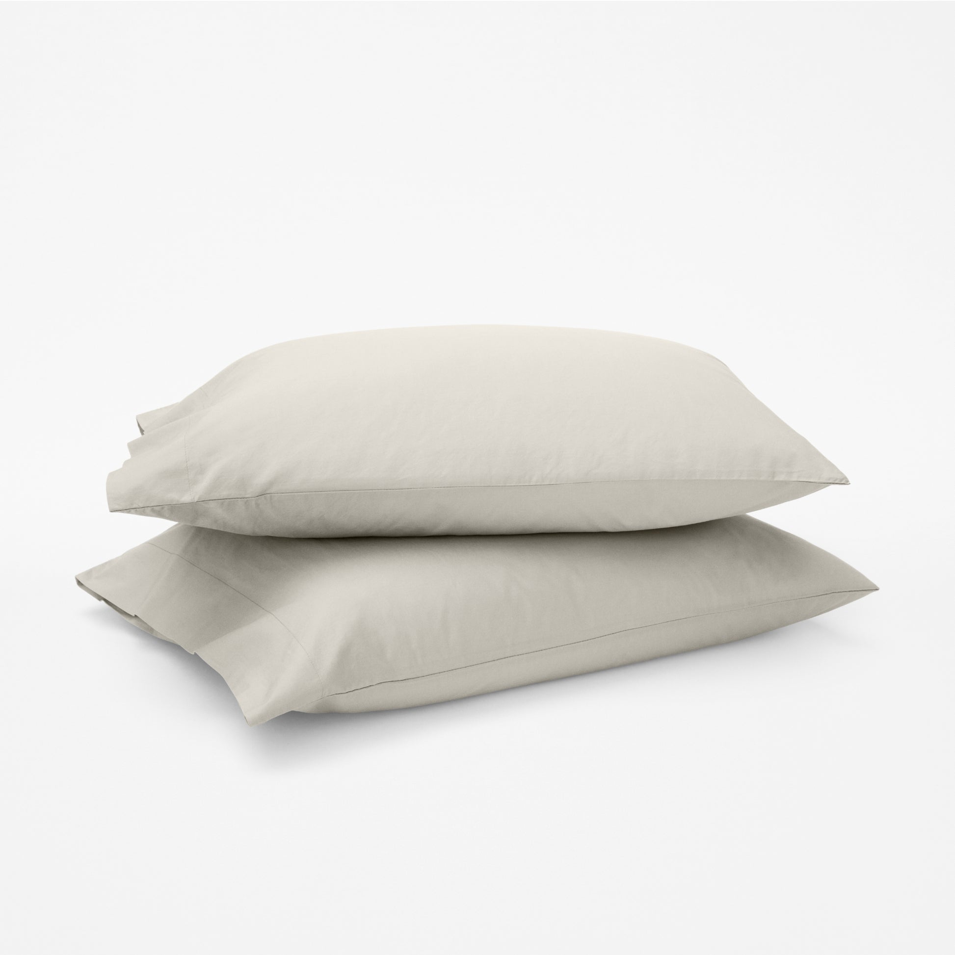 The Tuft and Needle Classic Percale Pillowcase Set, 2 pillows in a pillowcase stacked on top of each other || color: Sand
