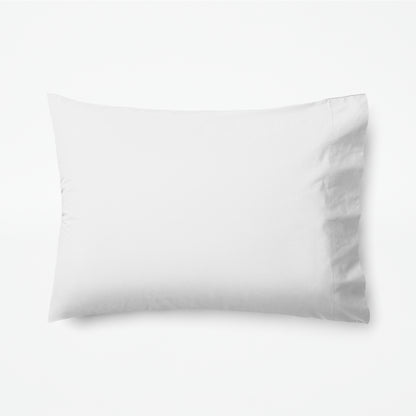 The Tuft and Needle Classic Percale Pillowcase Set, 1 pillow in a pillowcase showing in a horizontal position || color: Cloud
