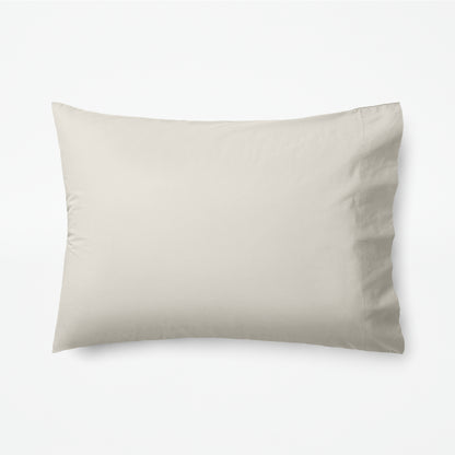 The Tuft and Needle Classic Percale Pillowcase Set, 1 pillow in a pillowcase showing in a horizontal position || color: Sand
