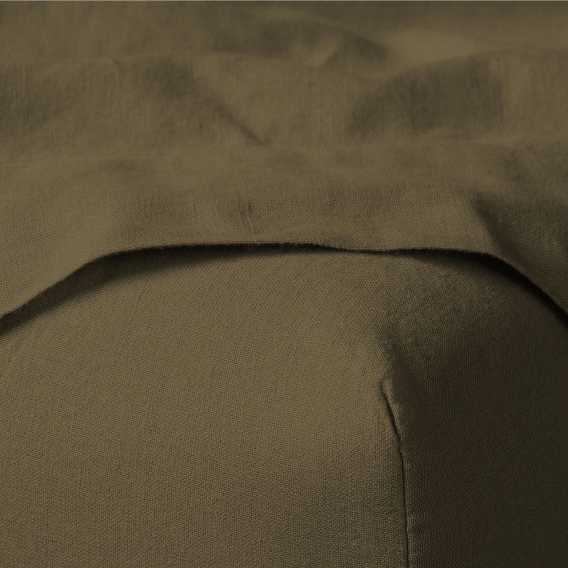The Tuft and Needle Linen-Cotton Blend Sheet Set, corner of a mattress with both sheets showing || color: Martini Olive

