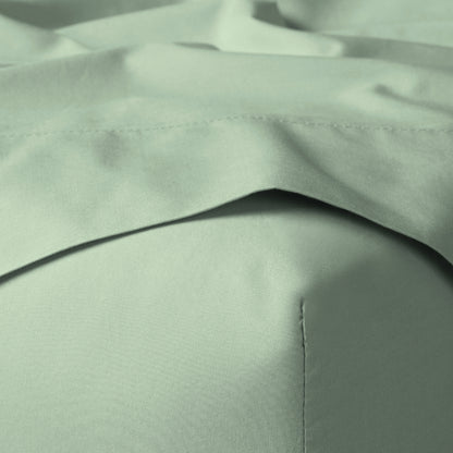 The Tuft and Needle Classic Percale Sheet Set, corner of a mattress with both sheets showing || color: Sage
