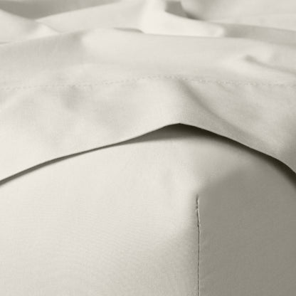 The Tuft and Needle Classic Percale Sheet Set, corner of a mattress with both sheets showing || color: Sand
