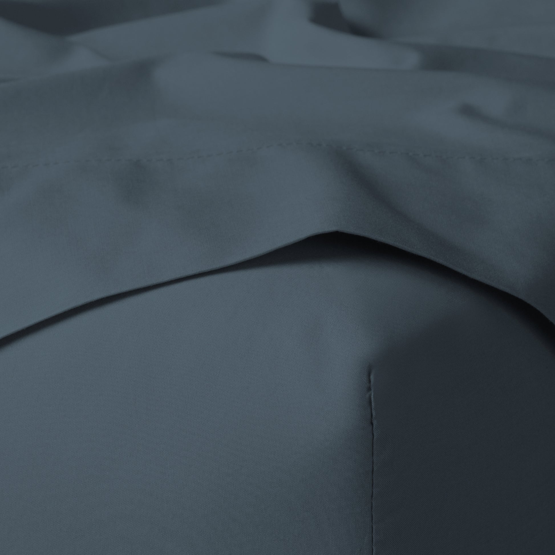 The Tuft and Needle Classic Percale Sheet Set, corner of a mattress with both sheets showing || color: Slate
