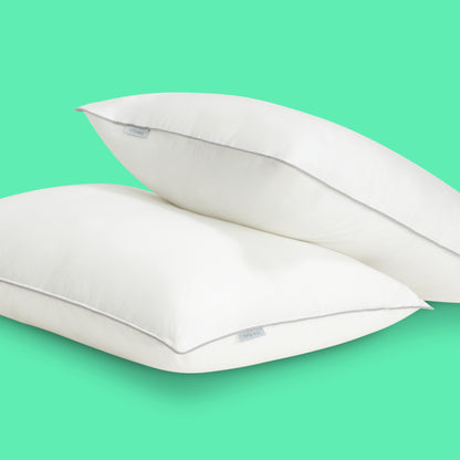Two Tuft & Needle down alternative pillows stacked
