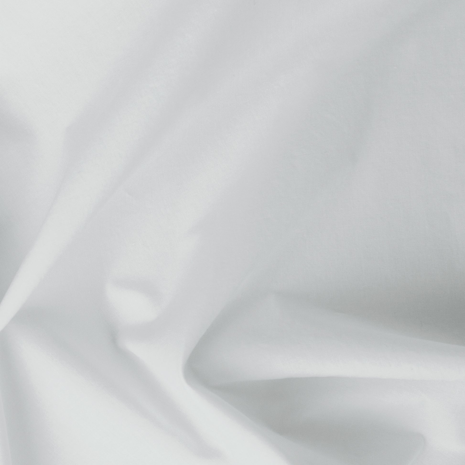 Close-up view of the fabric on the Tuft and Needle Percale Pillowcase Set||color:glacier