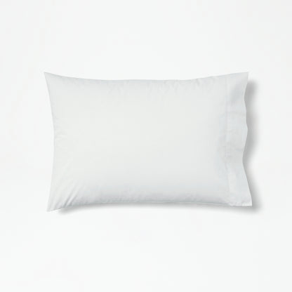 The Tuft and Needle Percale Pillowcase Set on one pillow||color:glacier