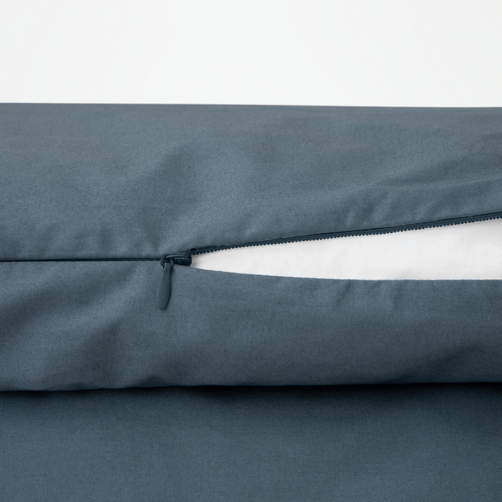 Close-up view of the zipper on the Tuft and Needle Percale Duvet Cover Set ||color:slate
