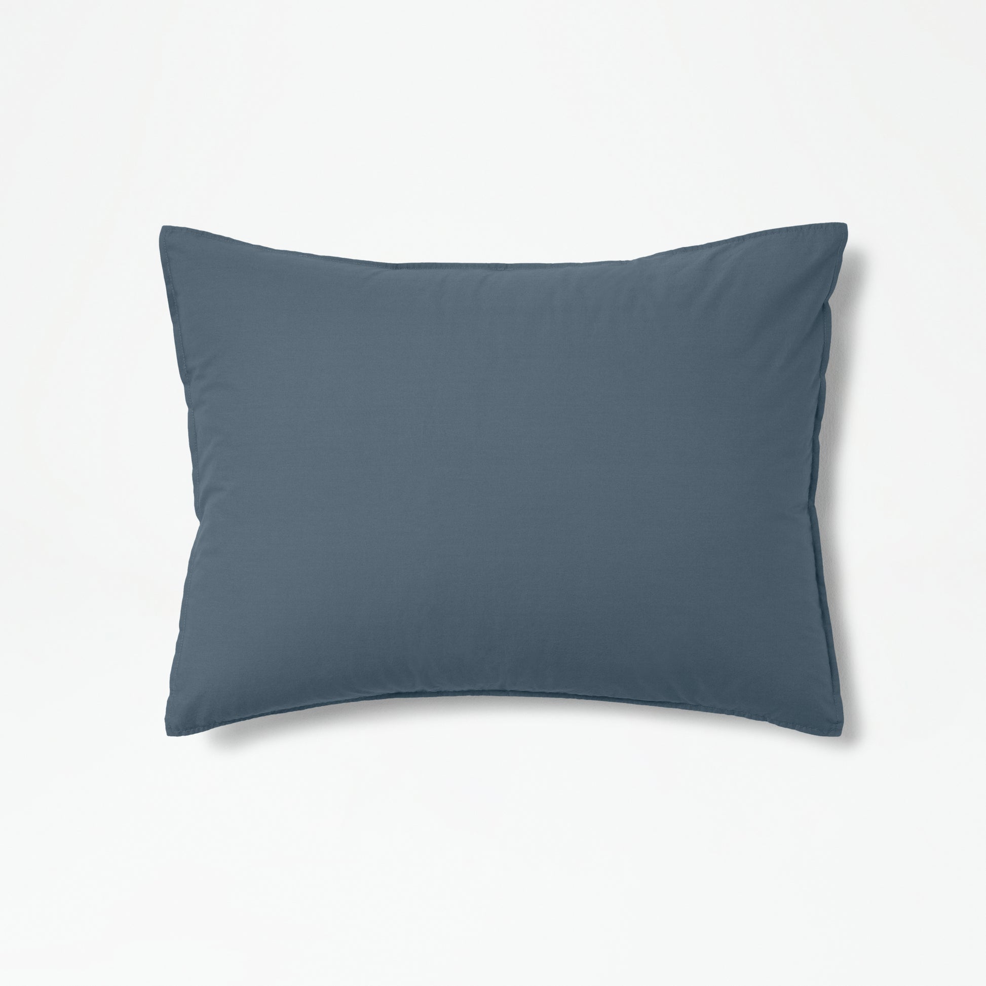 The Tuft and Needle Percale Duvet Cover Set on a pillow ||color:slate