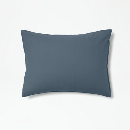 The Tuft and Needle Percale Duvet Cover Set on a pillow ||color:slate