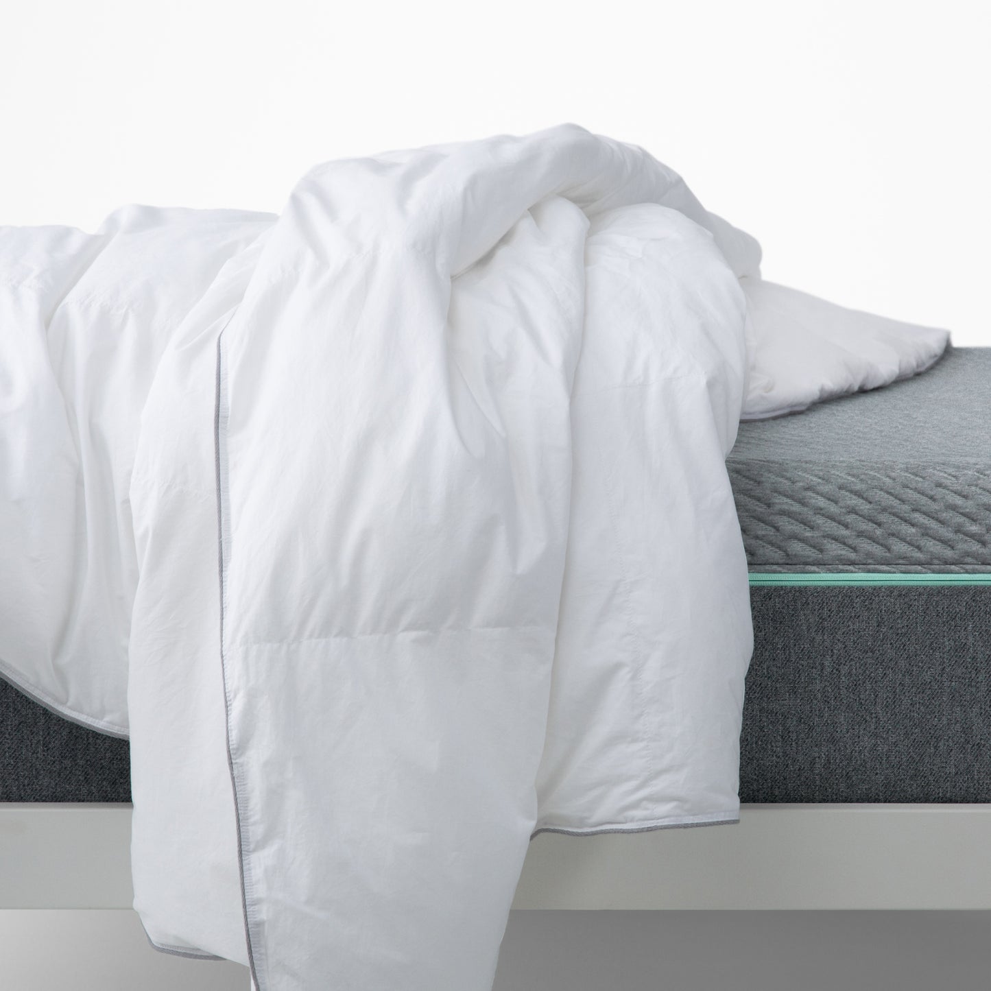 The Tuft and Needle Alternative Duvet Insert laying on a bed||weight:medium