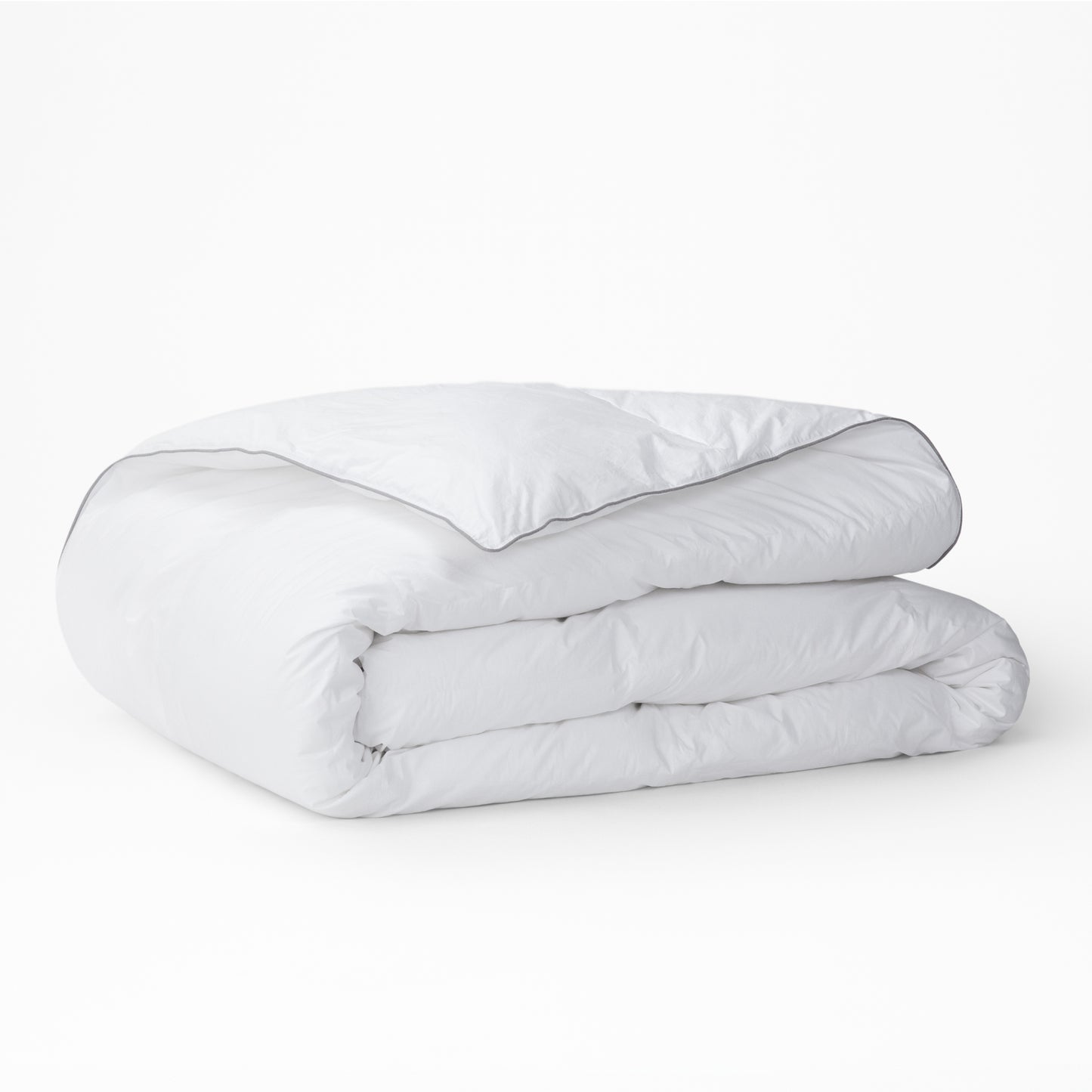 The Tuft and Needle Alternative Duvet Insert folded on a white background||weight:medum