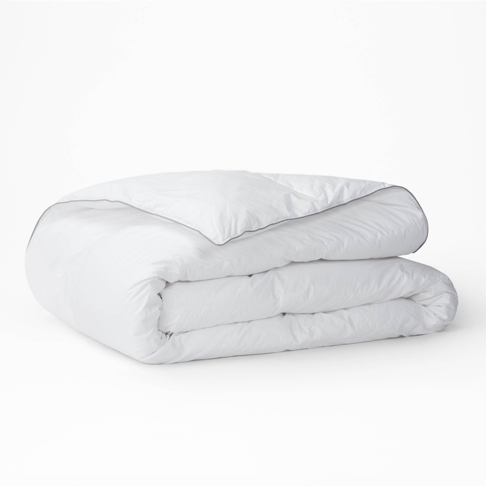 The Tuft and Needle Alternative Duvet Insert folded on a white background||weight:medum