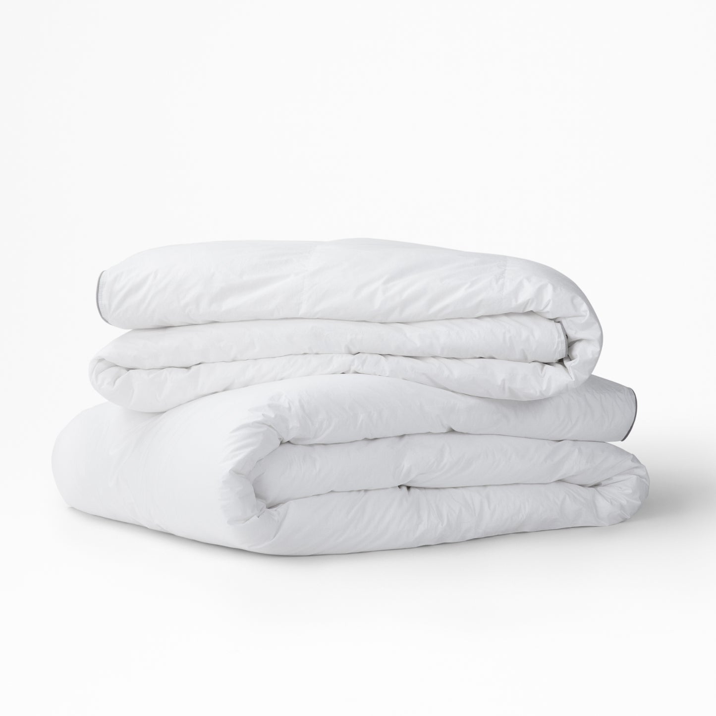 The Tuft and Needle Alternative Duvet Insert folded and stacked||weight:light