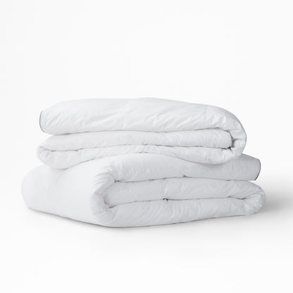 The Tuft and Needle Alternative Duvet Insert folded and stacked||weight:light